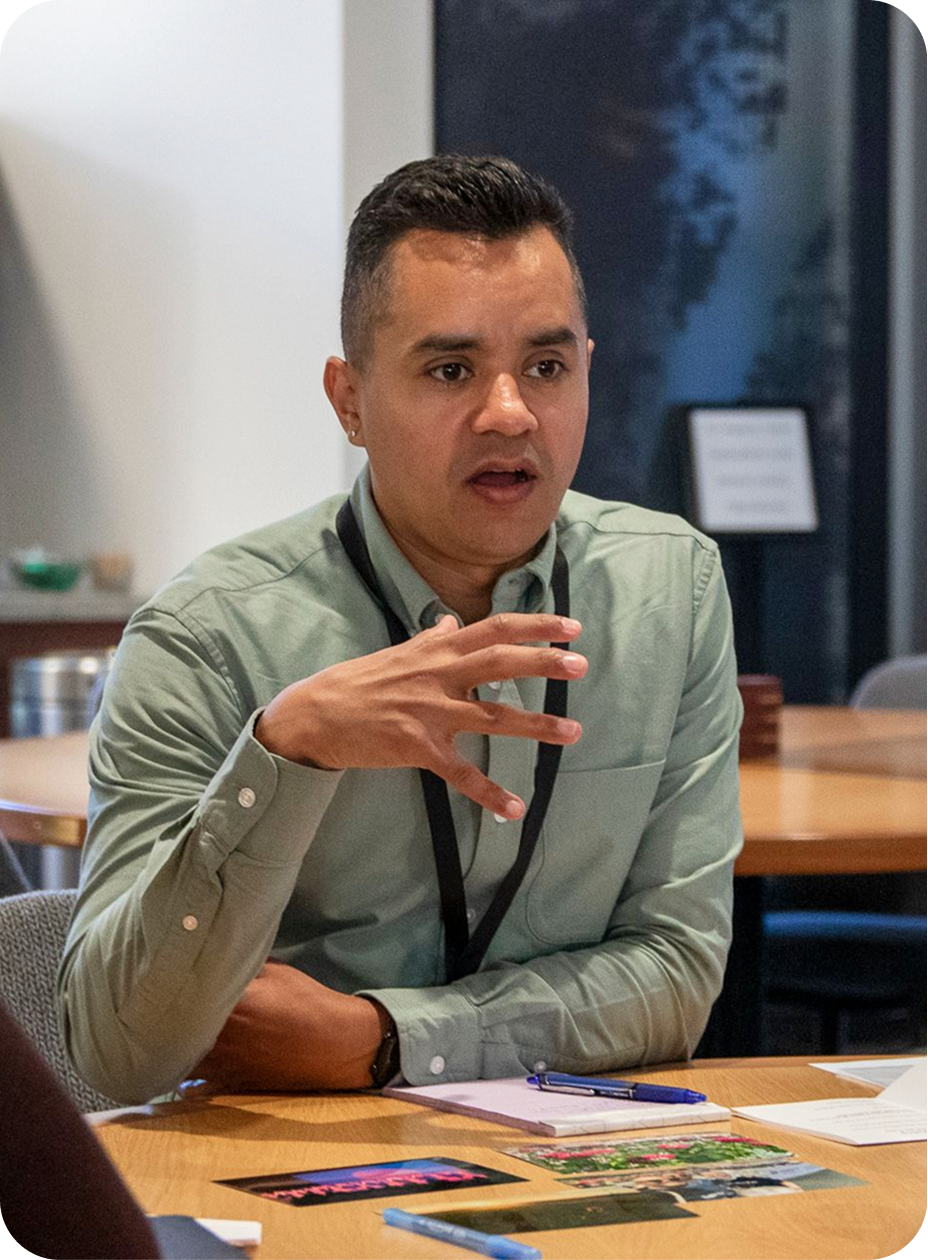Someone speaking at a table.